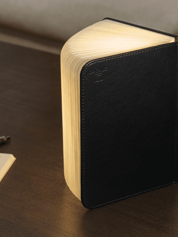 small black leather book light in a home