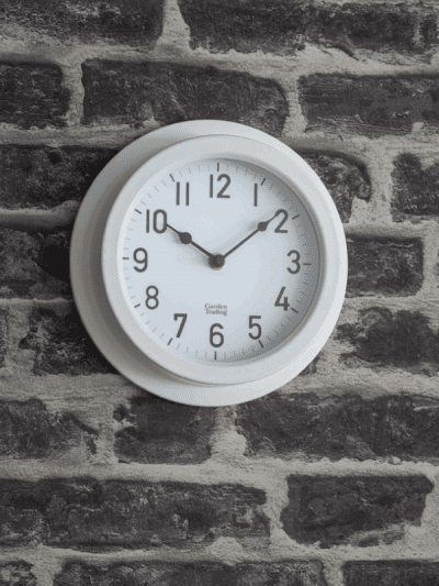 Garden Trading Clock on a brick wall