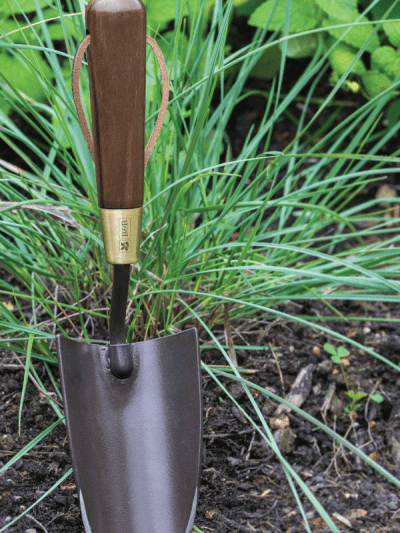 Burgon & Ball National Trust hand trowel in a garden
