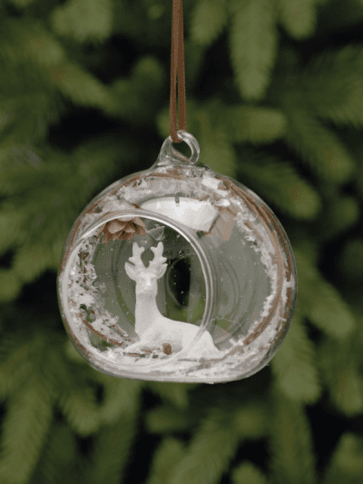 festive open glass bauble with deer inside