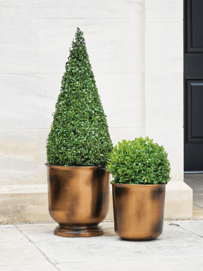 large copper urn style outdoor planters