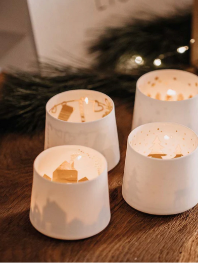 Räder Shadow Play Tealight Holder in white porcelain with gold Deer snowscape interior.
