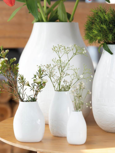 Set of three organic-shaped porcelain mini vases by Räder, designed by Sarah Blienert with matte and glossy finishes.