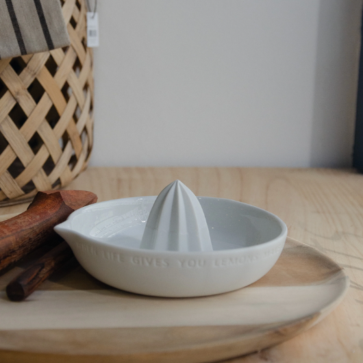 Lemon-shaped porcelain citrus squeezer by Räder Design with “When life gives you lemons, make lemonade” engraved