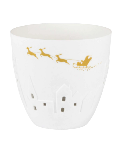 White and gold porcelain Räder Poetrylight tealight holder featuring Santa’s sleigh and reindeer with embossed houses.