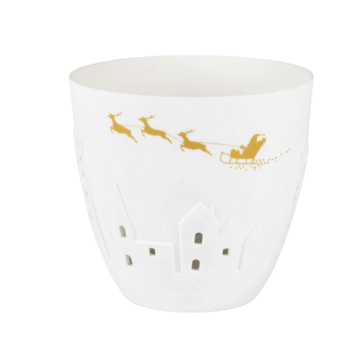 White and gold porcelain Räder Poetrylight tealight holder featuring Santa’s sleigh and reindeer with embossed houses.