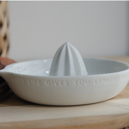 Lemon-shaped porcelain citrus squeezer by Räder Design with “When life gives you lemons, make lemonade” engraved