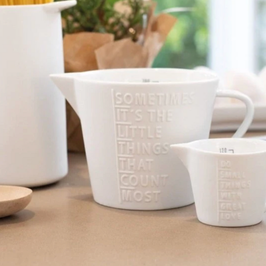 Small white porcelain measuring jug by Räder Design, 120 ml capacity, perfect for minimalist kitchens and accurate measuring.