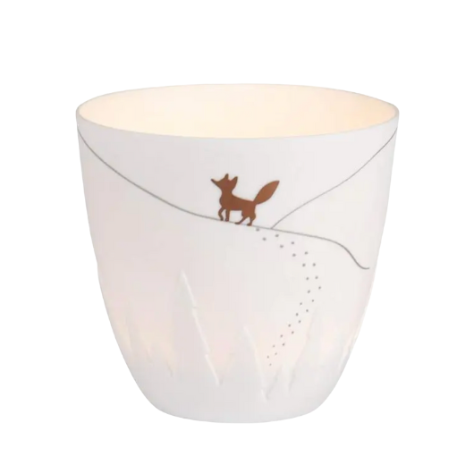 White porcelain Räder Poetrylight Fox tealight holder with golden fox and embossed trees.