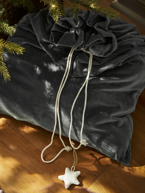 Hyde Christmas Sack in luxurious fern green cotton velvet. A large, elegant Christmas gift sack designed to hold presents too big for a stocking — perfect for hanging at the end of the bed on Christmas Eve.