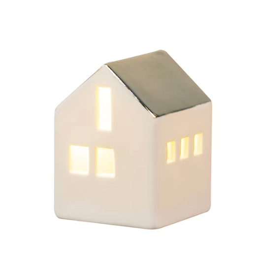 Mini porcelain LED illuminated house by Räder Design glowing softly, 4.5cm tall, battery-operated decorative light.