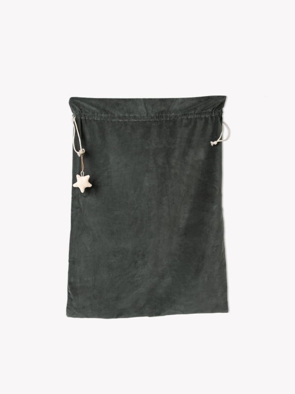 Hyde Christmas Sack in luxurious fern green cotton velvet. A large, elegant Christmas gift sack designed to hold presents too big for a stocking — perfect for hanging at the end of the bed on Christmas Eve.