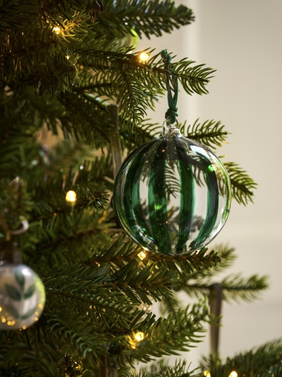 Set of three clear glass Purton Striped Christmas Baubles with hand-painted berry stripes and matching velvet ribbons, hanging on a Christmas tree.