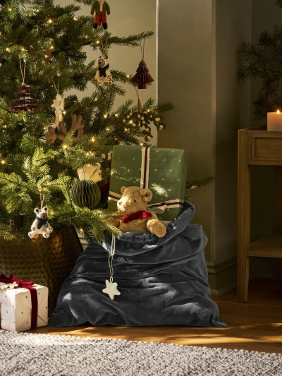 Hyde Christmas Sack in luxurious fern green cotton velvet. A large, elegant Christmas gift sack designed to hold presents too big for a stocking — perfect for hanging at the end of the bed on Christmas Eve.
