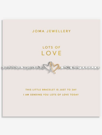 Joma Jewellery Forever Yours Lots Of Love bracelet with silver and gold interlocked heart charm on blush pink sentiment card.