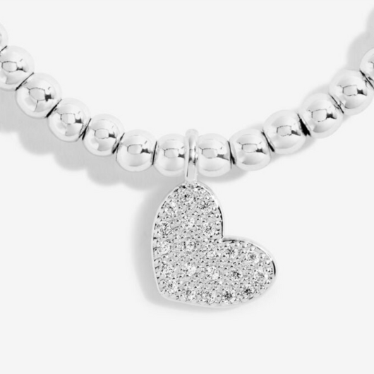 Celebrate their 18th with Joma’s Enchanting Eighteen Bracelet. A silver-plated heart charm bracelet on a sentiment card, perfect for meaningful birthday gifting.