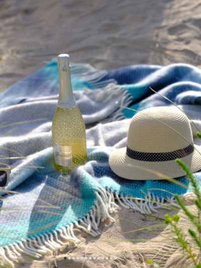 Sand Cornwall Porthminster Beach pure new wool throw in blue ombré with cream tassels.