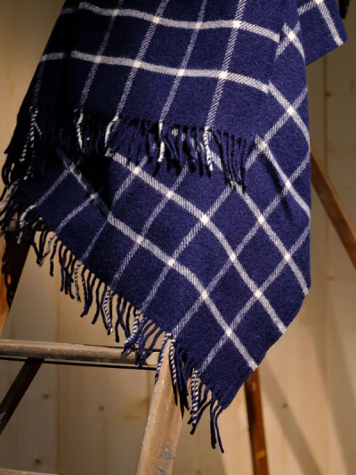 Navy chequered check pure new wool blanket throw with tasselled edge.