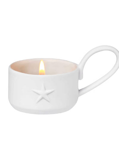 Räder Little Light Star tealight holder in glazed and unglazed porcelain with embossed star decoration.