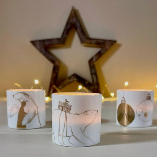 Räder Polar Bear tea light holder in porcelain, 4.5×4 cm, polar bear carrying a gift with gold detailing.