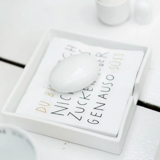 Räder napkin holder with pebble detail, 14×14×3 cm, holding cocktail napkins neatly.