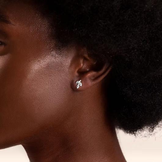 Model wearing Joma Jewellery Forever Family silver-plated heart stud earrings symbolising love and togetherness.