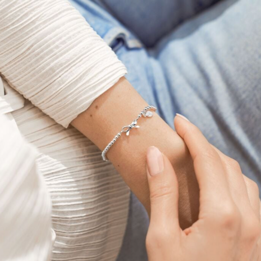 A Little Thank You Bracelet – silver-plated bow charm on stretch design with sentiment card.