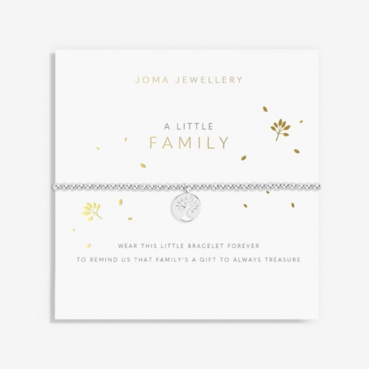 A Little Family Bracelet – silver-plated circular charm with cut-out tree design on stretch bracelet.