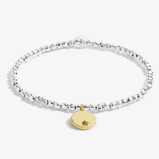 Radiance A Little One In A Million bracelet with gold star cutout charm on sentiment card.