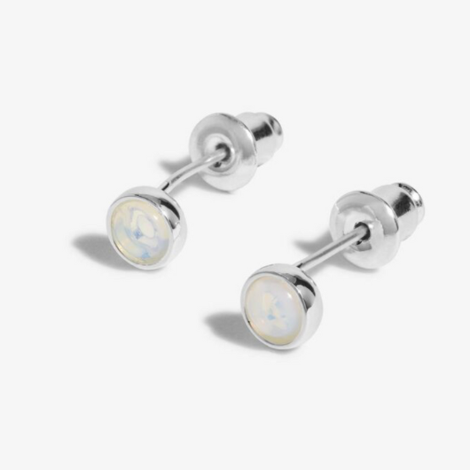 Close-up of Joma Jewellery June Birthstone Earrings featuring Moonstone and month traits card.