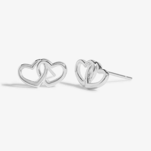 Close-up of Beautifully Boxed A Little ‘Forever Friendship’ Earrings with butterfly backs and heart charms.