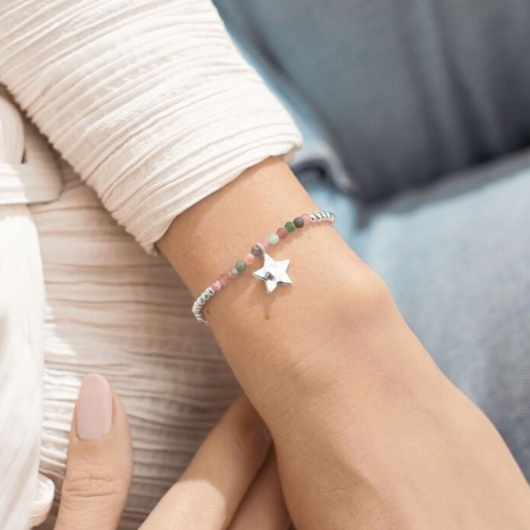 Joma Jewellery A Little October Birthstone bracelet with tourmaline stones and silver star charm on sentiment card.