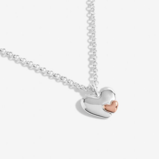 Joma Jewellery A Little Mummy To Be silver-plated necklace with heart charm on stylised sentiment card.