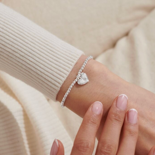 Joma Jewellery A Little Happy Birthday silver-plated bracelet with charm on sentiment card.
