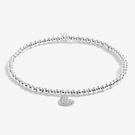 Celebrate their 18th with Joma’s Enchanting Eighteen Bracelet. A silver-plated heart charm bracelet on a sentiment card, perfect for meaningful birthday gifting.