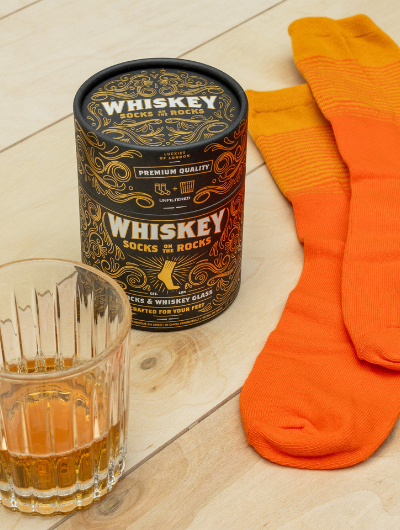 Whiskey Socks on the Rocks gift set with cotton-rich socks and cut-glass whiskey tumbler.