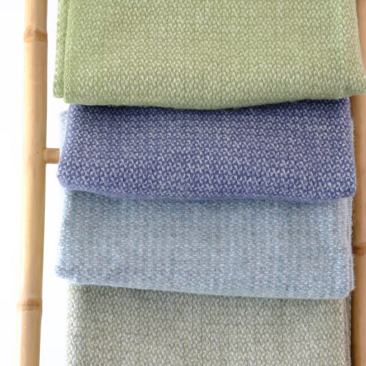 Green and grey pure new wool blanket Throw with circular weave and cream tassels, Sand Cornwall