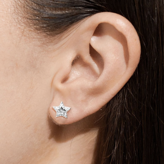 Model wearing Joma Jewellery A Little Happy Birthday silver-plated stud earrings — the perfect birthday gift.