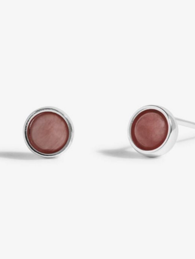 Close-up of Joma Jewellery October Birthstone Earrings with Tourmaline stones and traits card.