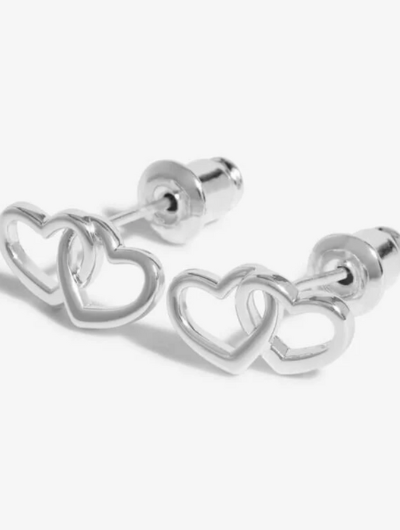 Close-up of Beautifully Boxed A Little ‘Forever Friendship’ Earrings with butterfly backs and heart charms.