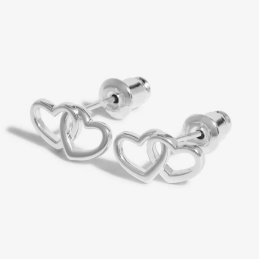 Close-up of Beautifully Boxed A Little ‘Forever Friendship’ Earrings with butterfly backs and heart charms.