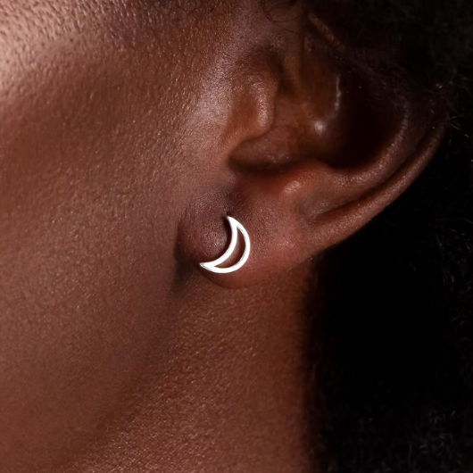 Model wearing Joma Jewellery Love You To The Moon and Back silver-plated moon stud earrings, representing endless love and connection.