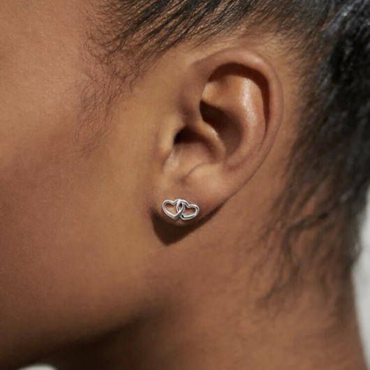 Close-up of Beautifully Boxed A Little ‘Forever Friendship’ Earrings with butterfly backs and heart charms.