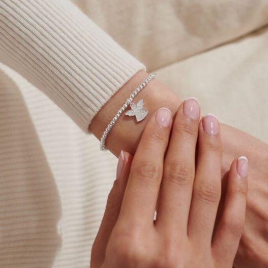Joma Jewellery A Little Angels Watching Over You silver-plated bracelet with angel charm on sentiment card.