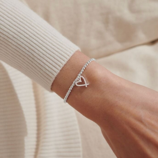 Joma Jewellery A Little Twinkling Twenty One bracelet with silver-plated heart charm on sentiment card.