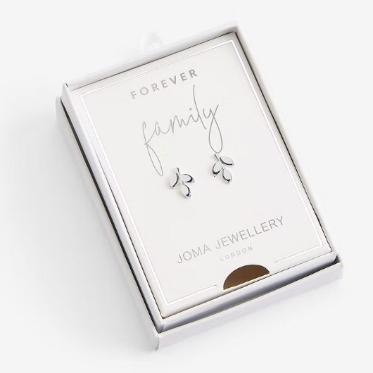 Joma Jewellery Forever Family earrings presented in a white Treasure The Little Things gift box with silver heart-shaped studs.