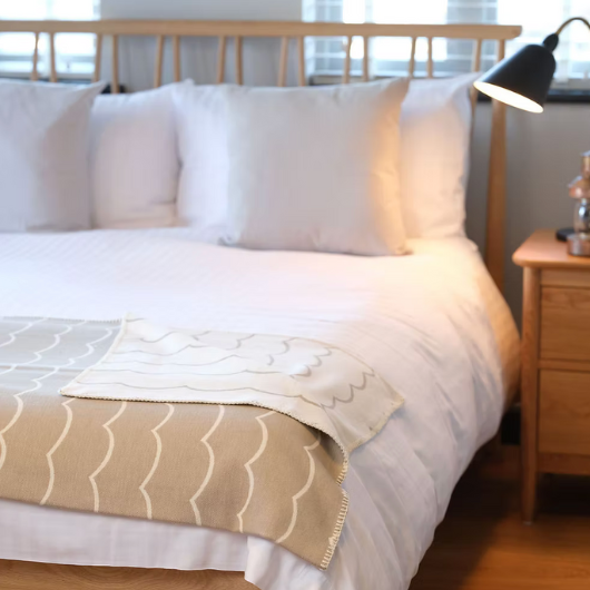 Wave mushroom organic cotton blanket throw with wave design and stitched edge,made in Britain