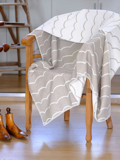 Wave mushroom organic cotton blanket throw with wave design and stitched edge,made in Britain.