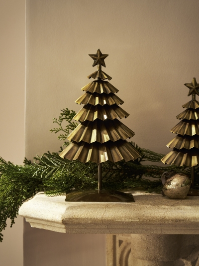 Close-up of antique brass Pershore Christmas Tree showing pleated texture and star detail.