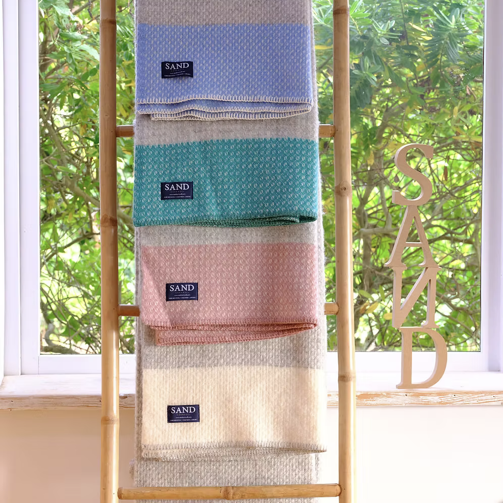 Crossweave Sea Blue Pure New Wool Blanket Throw with light grey base and bright blue stripe, folded neatly.